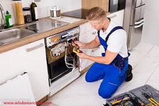 Electricians installing dishwasher