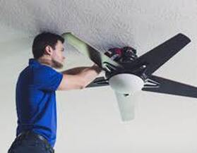 electrician fixing ceiling fan